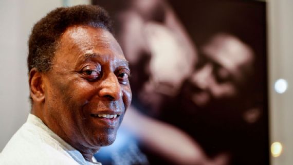 Pele's daughter posted a photo of herself hugging the King in a hospital bed.